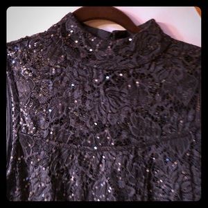 Sleeveless sequenced mock neck party dress.